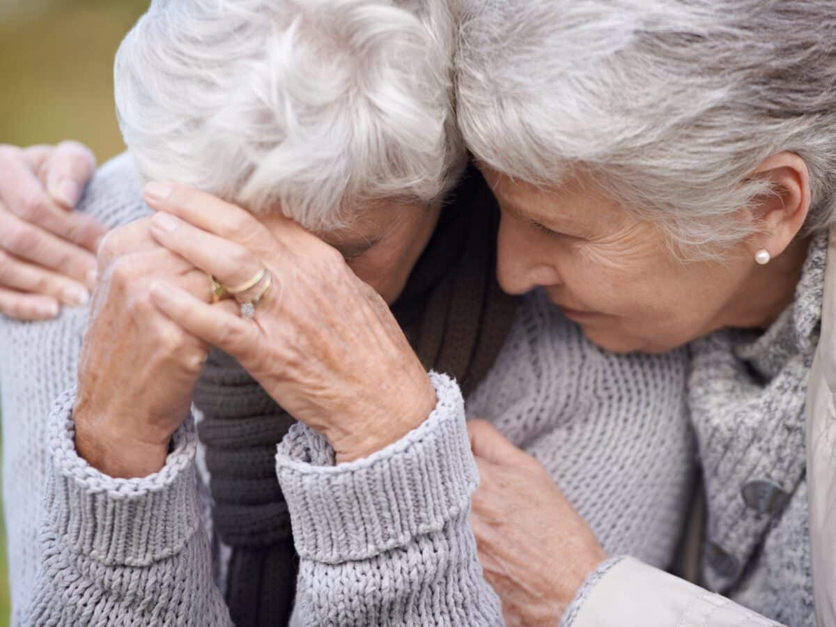 Senior,Women,,Friends,And,Crying,In,Nature,,Embrace,And,Grief