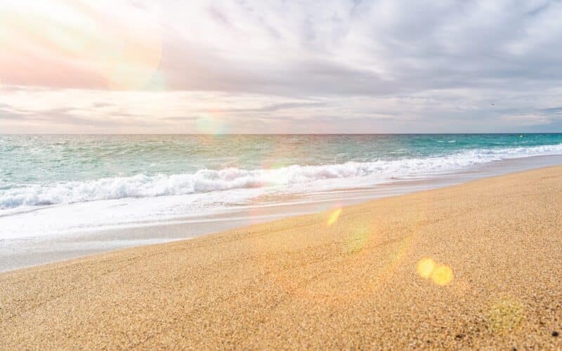 A,Serene,Beach,Scene,With,Golden,Sand,And,Turquoise,Ocean