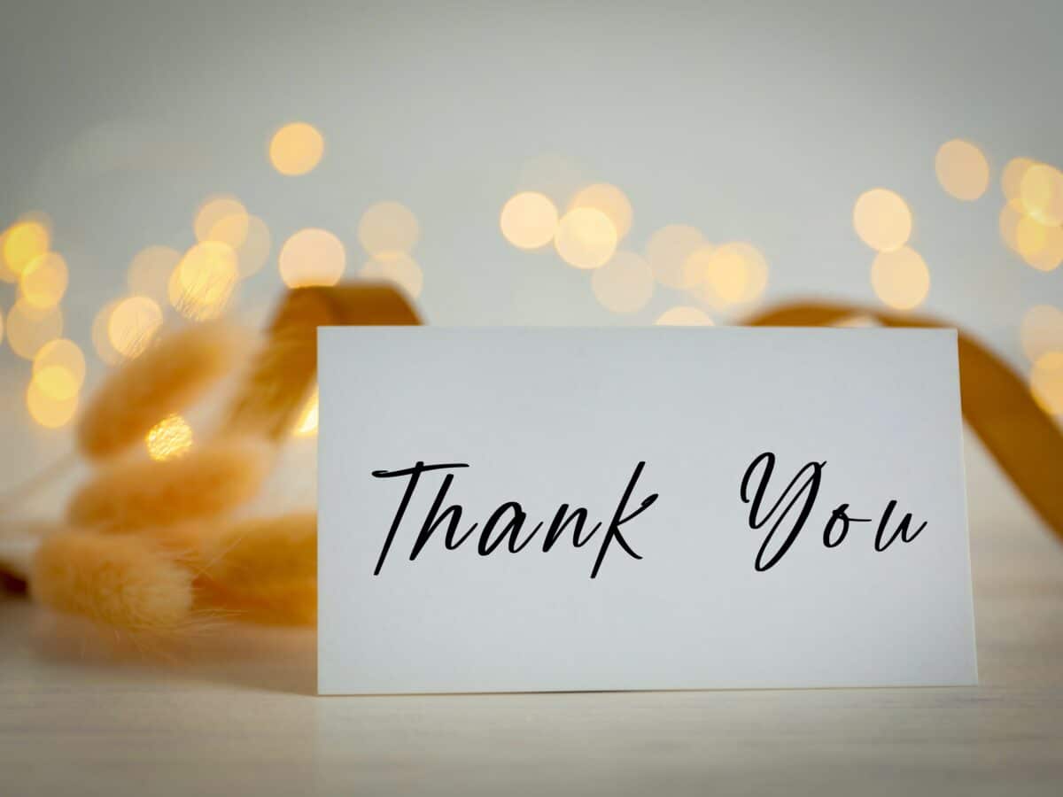 Thank,You,Card,And,Bokeh,Lights,On,White,Background,,Closeup